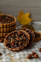 Autumn delicious cakes with nuts on plate.