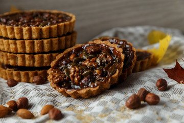 Autumn delicious cakes with nuts on plate.