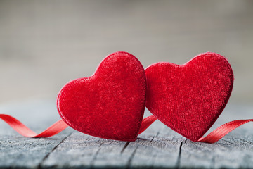 Fototapeta premium Saint Valentines day background with pair red hearts for holiday greeting card.