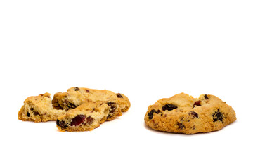 Two cookies with raisins broken into pieces.