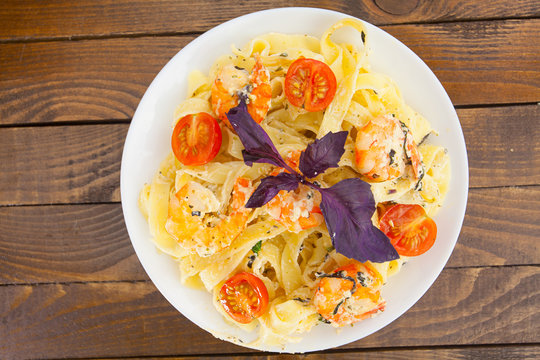 pasta with prawns on white plate