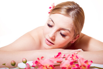 Portrait pretty woman during spa massage procedures in salon