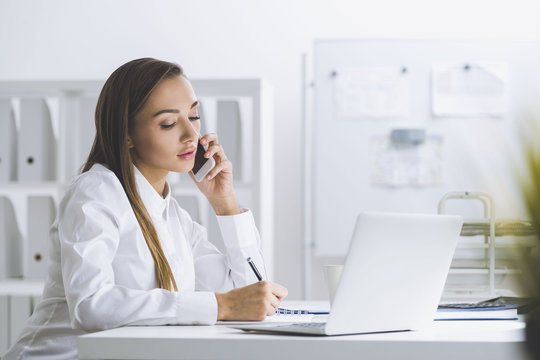 Serious businesswoman on her phone