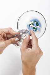 Pills on hands. Medicine background. Women taking pills