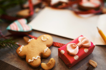 Tiny gift box with gingerbread cookies and note. Blank greeting card with sweet snacks, romantic present for valentines, free space. Love, handmade surprise, pastry concept