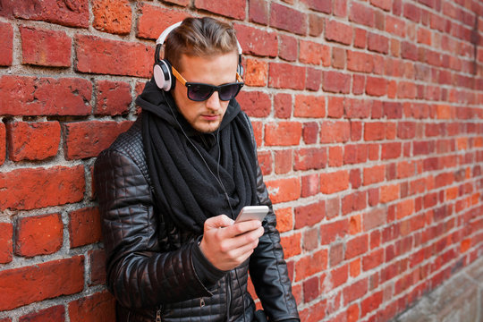 Man listening to music on headphones from his phone