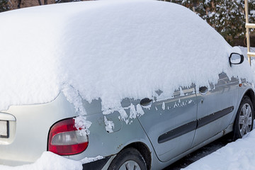 Car under the white snow.