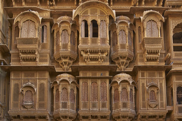 Fototapeta na wymiar Detail of ornate window screens adorning the Patwon Haveli, a historoc merchants house, in the old town of Jaisalmer in Rajasthan, India.