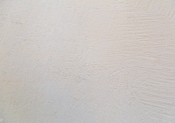 The texture of plaster walls pale yellow rough texture