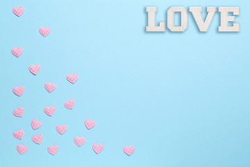 Plain blue background with love and little hearts 