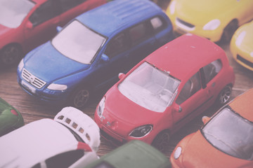 Close up of colorful toy cars. Shallow DOF. Vintage Retro Filter