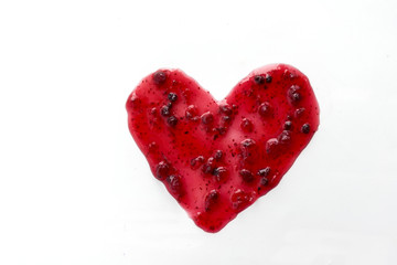 Berry jam heart isolated on white