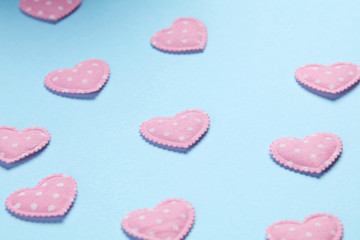 Pink hearts on blue background