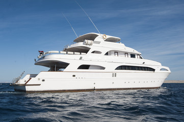 Large private motor yacht out at sea