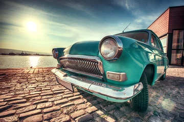 Tuinposter Vintage car near the sea © ValentinValkov