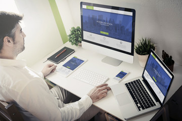 man working with devices modern web design