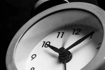 Alarm Clock on Black Background. Time Management Concept.