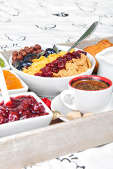 Daily breakfast on a wooden tray. Breakfast in bed