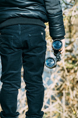 .Boy with binoculars in the field