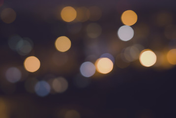 Christmas festive abstract holidays background with bokeh defocused lights and stars