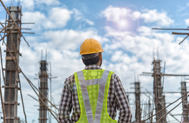 Young man architect on a building construction site