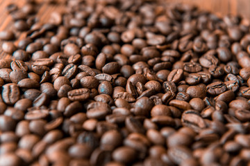 Coffee beans on wood background