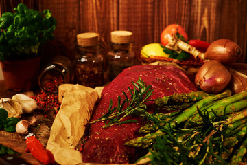 Fresh raw meat with herbs, spices and vegetables