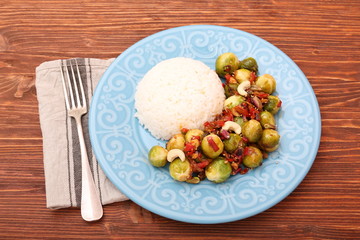 Roasted brussels sprouts on a blue plate