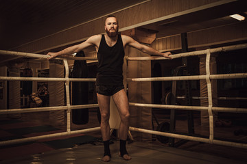 Fototapeta na wymiar Professional fighter on training ring
