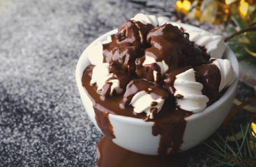 Cup of hot chocolate with marshmallows on snowy table, Christmas, New Year, Winter background