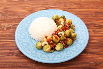 Roasted brussels sprouts on a blue plate