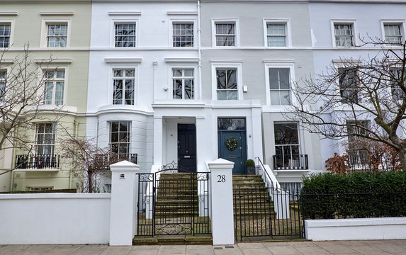 Residential housing with typical entrances with stairs on Ladbroke Grove in Notting Hill