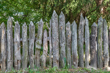The old wooden fence in the countryside
