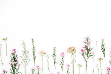 Obraz premium Colorful wildflowers on white background. Flat lay, top view. Valentine's background