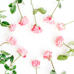 Obraz premium Heart symbol made of pink roses on white background. Flat lay, top view. Valentine's background.