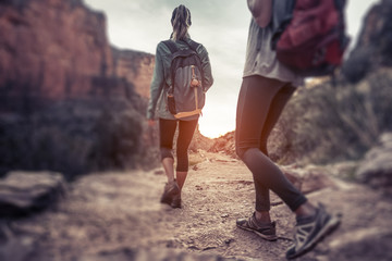 Two lady hiker on the walkway at the Grand Canyon National Park, USA