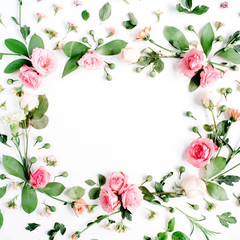 Fototapeta na wymiar Round frame made of pink and beige roses, green leaves, branches, floral pattern on white background. Flat lay, top view. Valentine's background