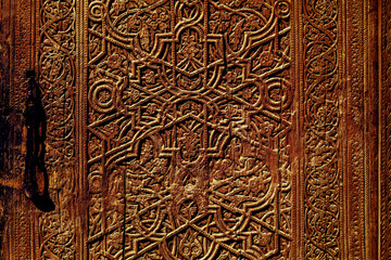 Orintal texture on a wood. Door in one of Uzbekistans' mosque