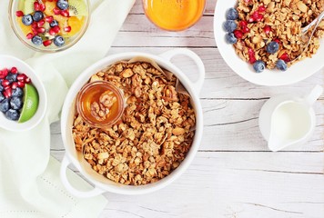 Breakfast set with granola, fruits salad, fresh juice and various of topping. Healthy eating concept
