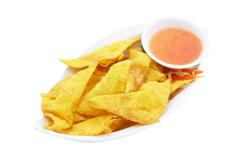 Crispy wonton with chili sauce isolated on white background.