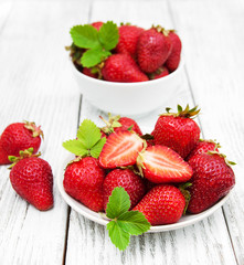 ripe strawberries on wooden table
