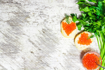 sandwiches with heart shaped red caviar and herbs