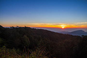 Landscape of sunrise over misty mountains in the morning at Chia