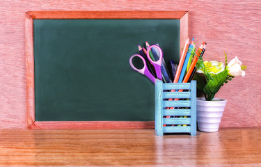 Green school chalkboard with written sentence space