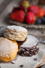 Mix flavour of scone biscuit decorate with chocolate ship and fresh strawberry and blueberry