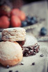 Mix flavour of scone biscuit decorate with chocolate ship and fresh strawberry and blueberry