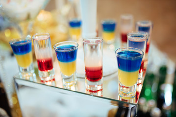 Beautiful line of different coloured cocktails