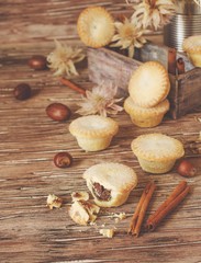 small round Christmas cakes with nuts and cinnamon, space for text
