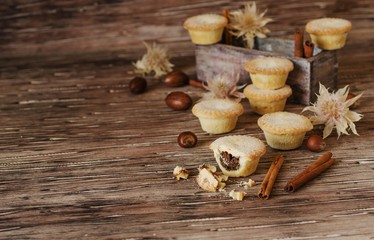 small round Christmas cakes with nuts and cinnamon, space for text
