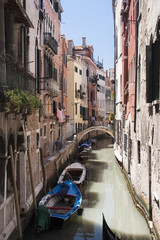 Fototapeta na wymiar Canal with boats in Venice, Italy